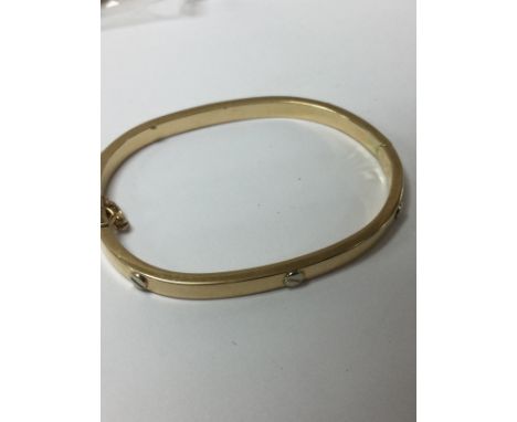 A 9 ct gold bangle total weight 11grams .