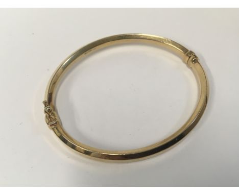 A 9ct gold bangle, Approx weight 5.2 grams.