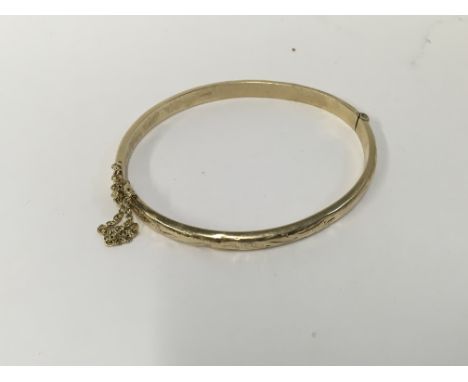 A 9ct gold bangle, Approx weight 7.58 grams.