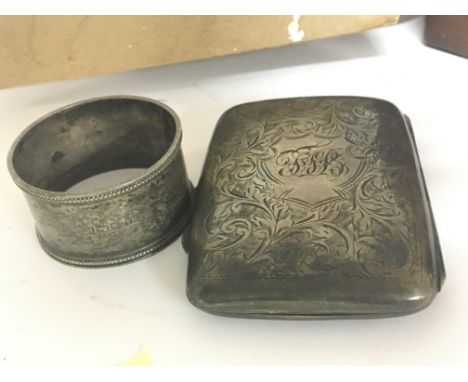 A silver cigarette case and a silver napkin ring weight 84g  (2)