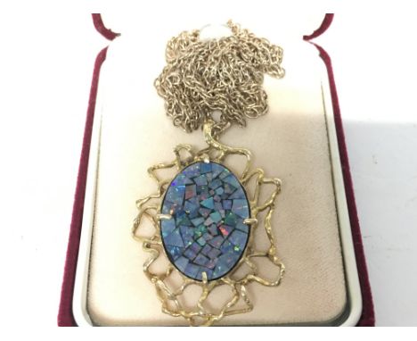 A pattern opal pendant with a 9ct gold mount and chain. Postage category A