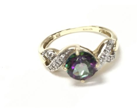 9ct yellow gold RC mystic topaz and diamond twist ring. Size N 1/2 and 2.33g.Boxed.