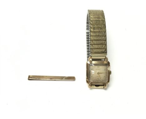 A 9ct ladies rotary watch (winds and runs) 44.68g and a 9ct tie pin 2.01gPostage B