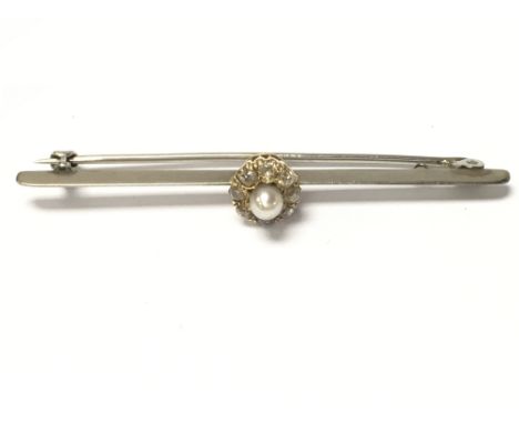 An Edwardian white gold seed pearl and diamond bar brooch. Postage category A. 