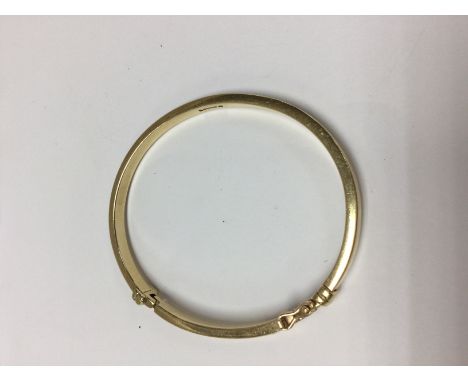 A 9 ct gold bangle total weight 31 grams.