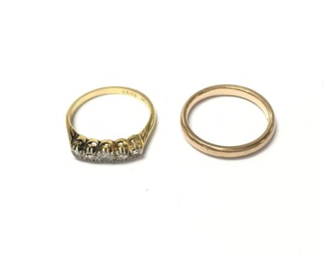 A 9ct gold wedding band size L and 2.46g and an 18ct gold 5 diamond ring size M and 2.51gPostage A