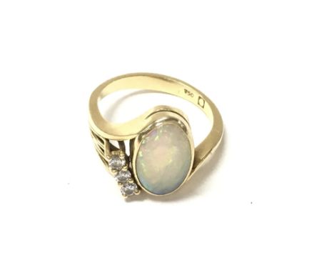 An 18ct gold Opal and diamond set ring. Size N and 4.84g