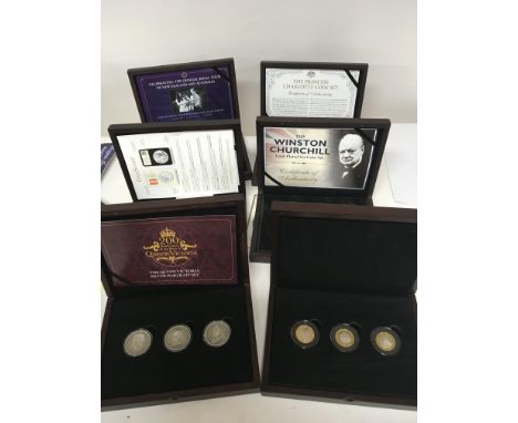 A collection of six cased commemorative coin sets The Queen Victoria Silver Portrait set silver D-Day leaders three coin set.