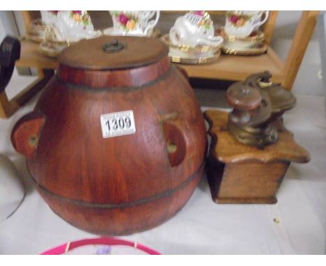 An oriental wooden lidded pot and a coffee grinder.