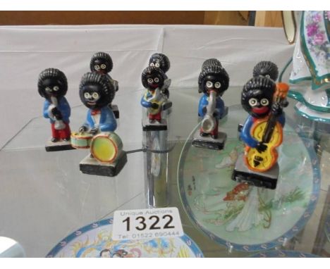 Nine Robertsons Golly figures. Notice from the the-saleroom.com: These items are listed on the basis they are illustrative of