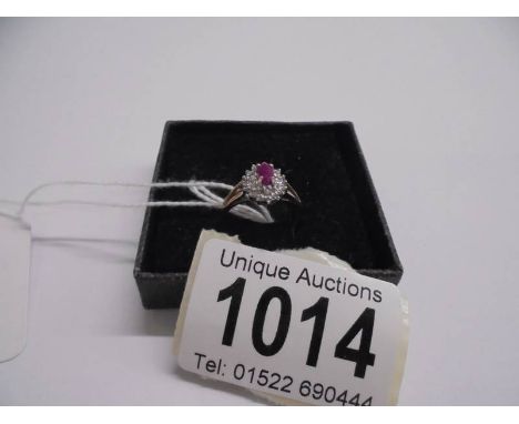 A yellow gold ruby and diamond ring, size L, 1.78 grams.