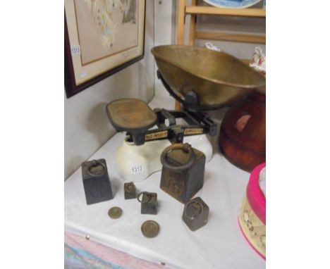 A large set of vintage Avery cast iron shop scales with brass pan and weights (8oz to 14lbs).