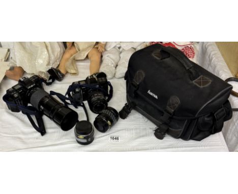 A Minolta camera with lenses &amp; carry bag