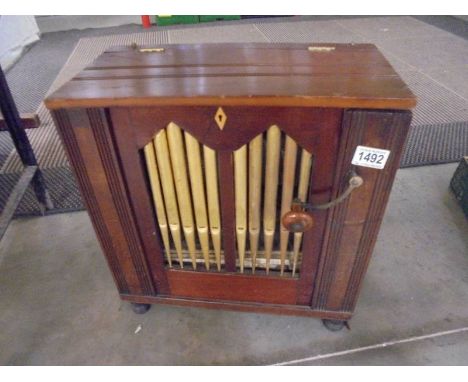 A 19th century parlour pipe organ, bellows in working order but missing three pipes.43 x 22 x Height 45cm Not including handl