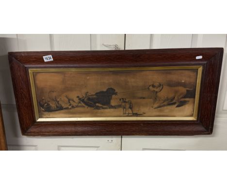 A large oak framed print of dogs playing tug-o-war