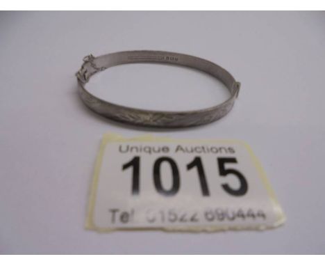 A silver bangle, 12 grams.