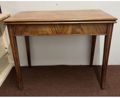A Victorian fold over card table