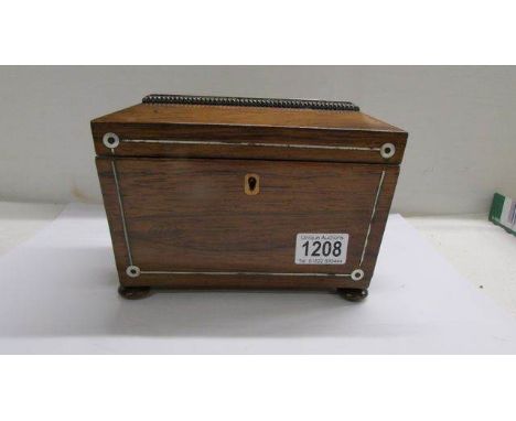 A Victorian mahogany tea caddy.