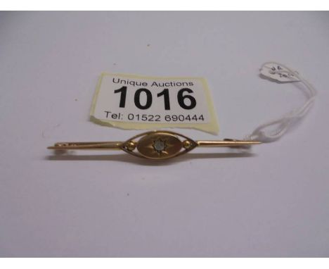 A 15ct gold tie/bar brooch with centre diamond, approximately 3.7 grams.