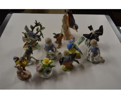 A collection of Beswick, Goebel and other ornaments in the form of birds etc.