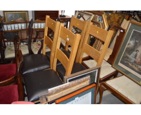 A set of four light oak dining chairs 