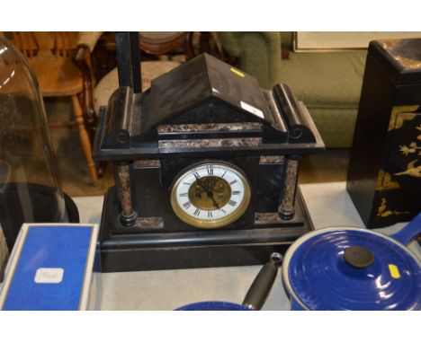 A black slate and marble two hole mantel clock 