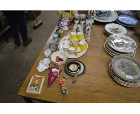 A quantity of coffee cans and saucers, shoe ornaments, figurines etc.