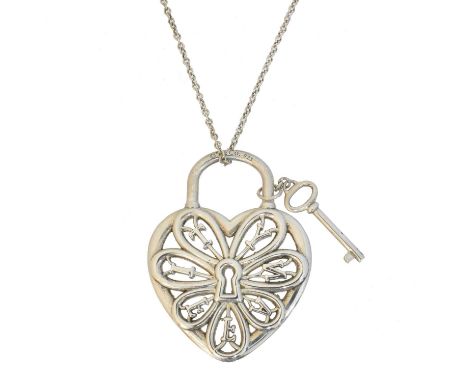 A Tiffany &amp; Co. padlock pendant, the openwork heart shape padlock pendant with key attachment, suspended from a trace lin