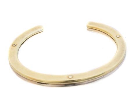 A Georg Jensen bangle, no. A78A, the silver and silver gilt open bangle with rounded screw detailing, maker's marks for Georg