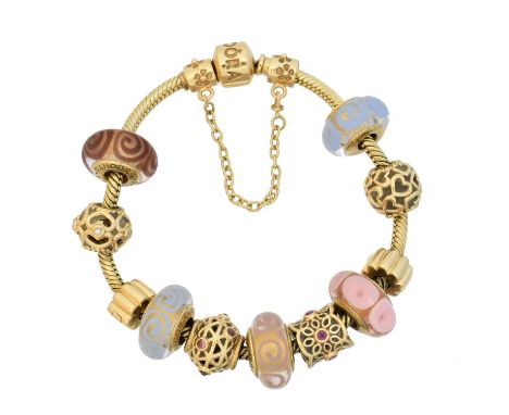 A 14ct gold Pandora charm bracelet, the fancy bracelet suspending twelve charms, maker's marks for Pandora, length 18cm, gros