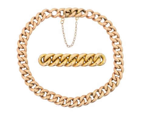 An early 20th century curb link chain bracelet, together with an accompanying brooch, stamped 9 and 10, lengths 20 and 4.2cm,
