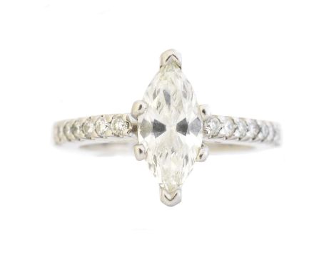 A diamond single stone ring, the marquise cut diamond weighing 1ct within a six claw setting, with brilliant cut diamond shou