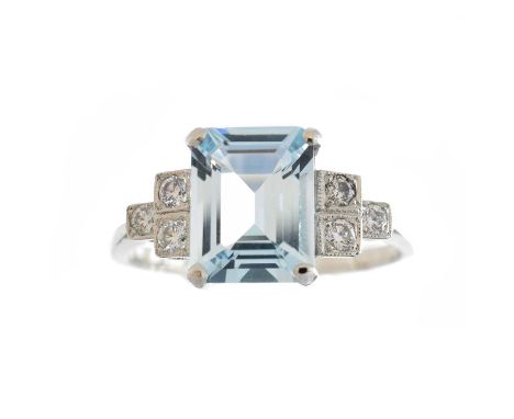 An aquamarine and diamond dress ring, the rectangular shape aquamarine weighing approx. 1.80cts with brilliant cut diamond st