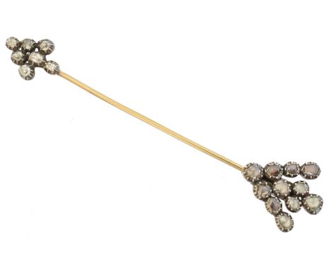 A diamond jabot pin, designed as an arrow, set with old and rose cut diamonds, length 8.7cm, gross weight 5.9g.Condition repo