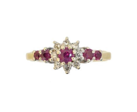 An 18ct gold ruby and diamond dress ring, the circular shape ruby and single cut diamond cluster with graduated circular shap