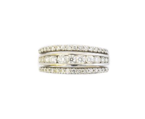 An 18ct gold diamond band ring, the brilliant cut diamond line with similarly cut diamond sides, total diamond weight 0.72ct,
