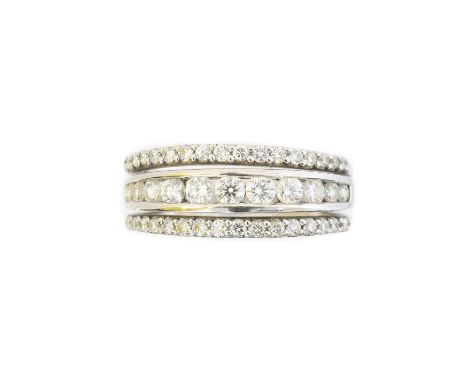 An 18ct gold diamond band ring, the brilliant cut diamond line with similarly cut diamond sides, total diamond weight 0.72ct,