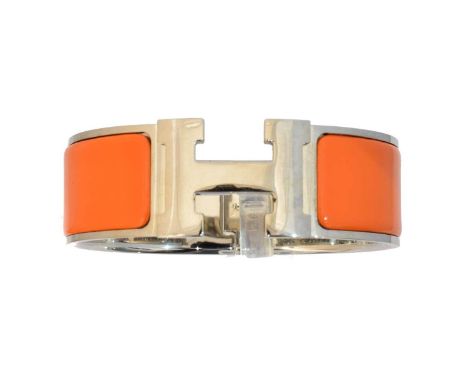 A Hermès 'Clic Clac' bangle, circa 2005, the orange enamel hinged bangle with maker's 'H' hinged clasp, signed Hermès, date s