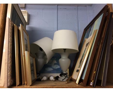 A shelf of assorted prints etc.