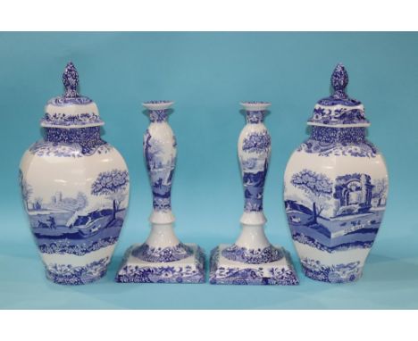 A large pair of Spode Italian candlesticks and a pair of jar and covers