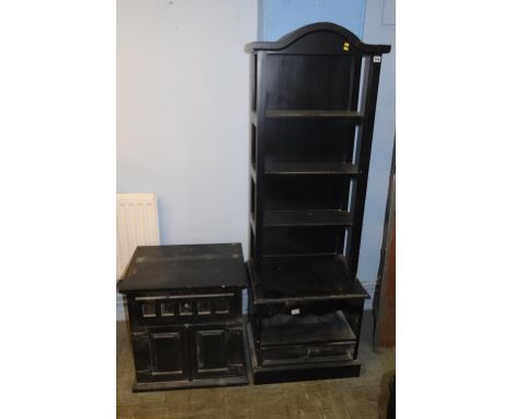 A black painted shelf with two bases