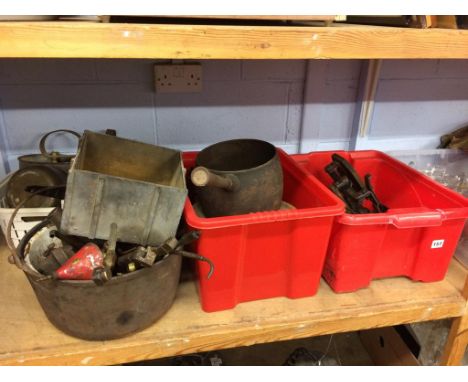 A shelf of assorted metalware