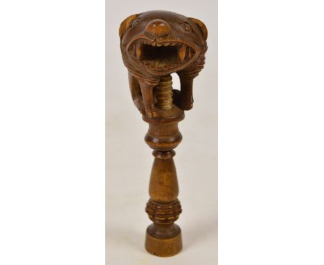 A late 19th/early 20th century Black Forest carved oak figural nutcracker, height 16.5cm (af). CONDITION REPORT: Losses to th