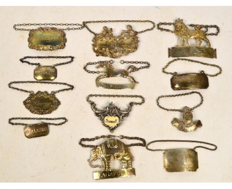 A collection of various hallmarked silver decanter labels including "Port", decorated with five cast figures of man drinking,