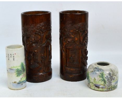 A pair of Chinese carved bamboo brush pots, height 21cm, a ceramic transfer decorated brush pot, height 12cm (af) and another