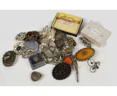 A collection of various costume brooches including two examples set with Scottish stone, two filigree examples and a mother o