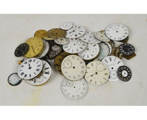 A collection of white enamel pocket watch faces, pocket watch movements and wristwatch movements.