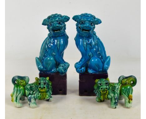 A pair of 20th century Chinese ceramic turquoise and purple glazed seated Dogs of Fo, with associated plinths, height 25.5cm,
