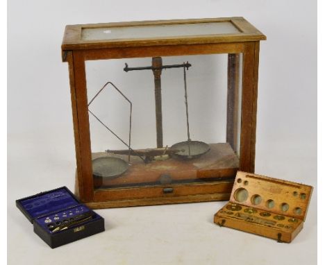 A set of chemist's balance scales (af), a cased set of weights and a further vintage cased set of brass weights (3).