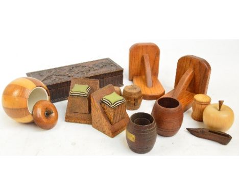 A small collection of treen to include a floral carved trinket box of rectangular form, 27.5 x 11cm, two pairs of oak book en